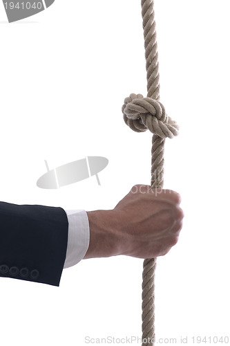 Image of business man with rope isolated on white background