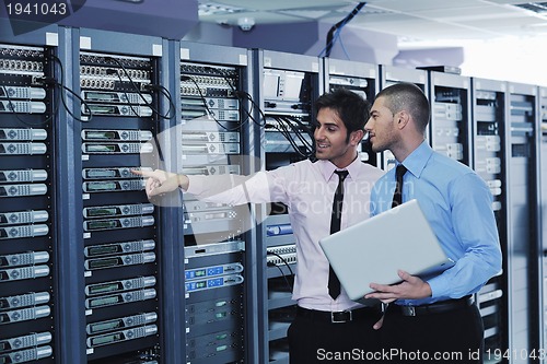 Image of it enineers in network server room