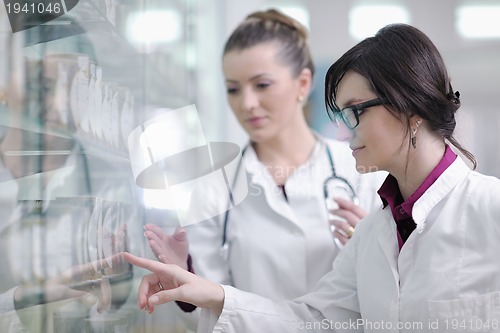 Image of team of pharmacist chemist woman  in pharmacy drugstore