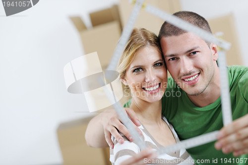 Image of Young couple moving in new house