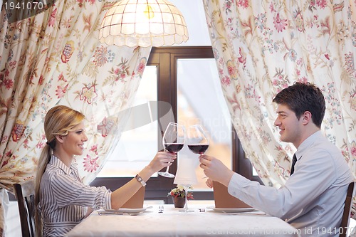 Image of young couple having dinner at a restaurant