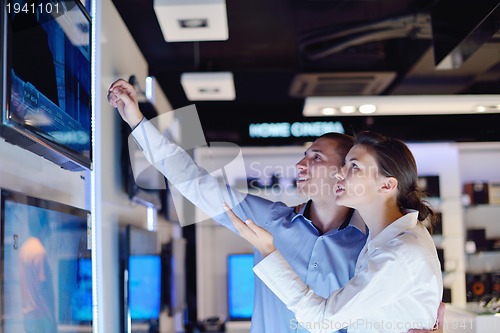 Image of people buy  in consumer electronics store