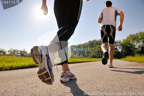 Image of Young couple jogging