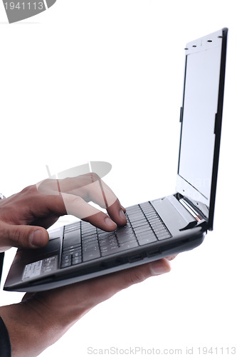 Image of business man work on mini laptop