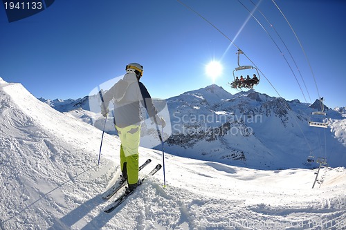 Image of skiing on fresh snow at winter season at beautiful sunny day