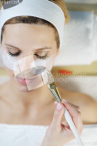 Image of Beautiful young woman in spa