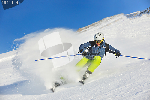 Image of skiing on fresh snow at winter season at beautiful sunny day