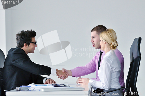 Image of Group of young business people at meeting