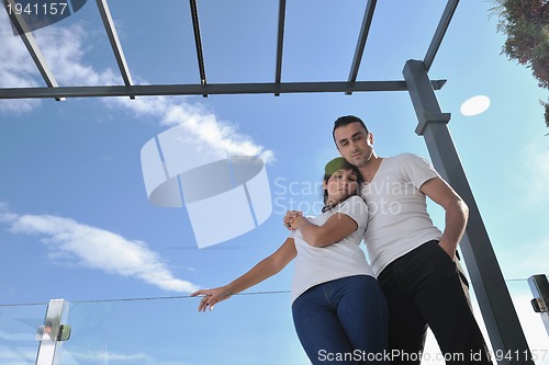 Image of couple relaxing on balcony