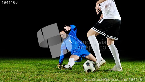 Image of football players in action for the ball