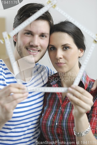 Image of Young couple moving in new home