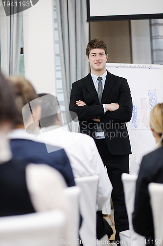 Image of Young  business man giving a presentation on conference
