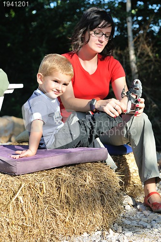 Image of woman and child have fun outdoor