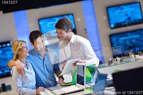 Image of people buy  in consumer electronics store