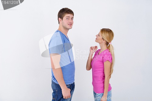 Image of happy couple paint wall at new home