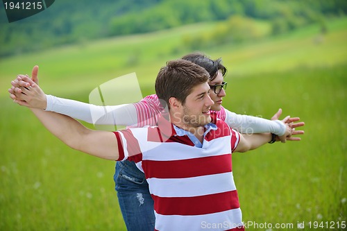 Image of romantic young couple in love together outdoor