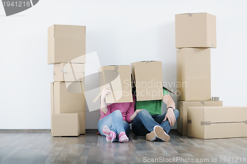 Image of Young couple moving in new house