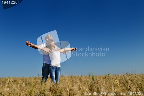Image of happy couple in wheat field