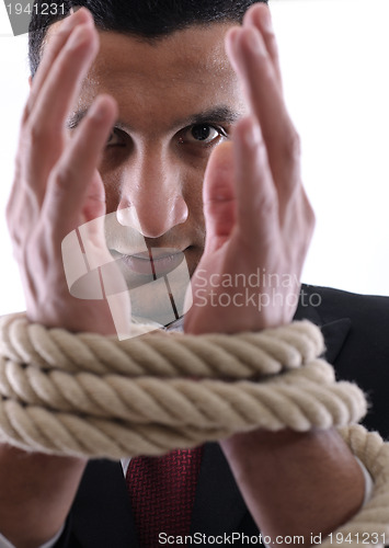 Image of business man with rope isolated on white background