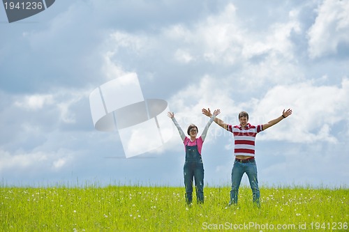 Image of romantic young couple in love together outdoor