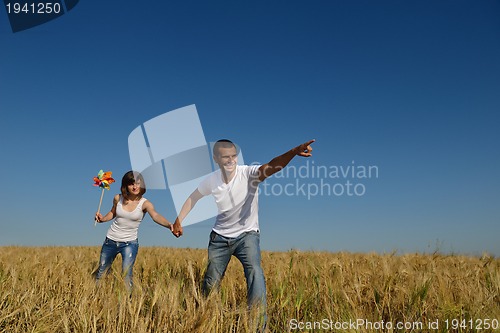 Image of happy couple in wheat field