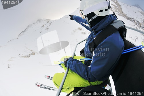 Image of skiing on fresh snow at winter season at beautiful sunny day