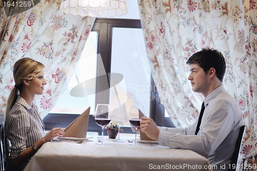 Image of young couple having dinner at a restaurant