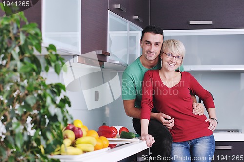 Image of young couple have fun in modern kitchen