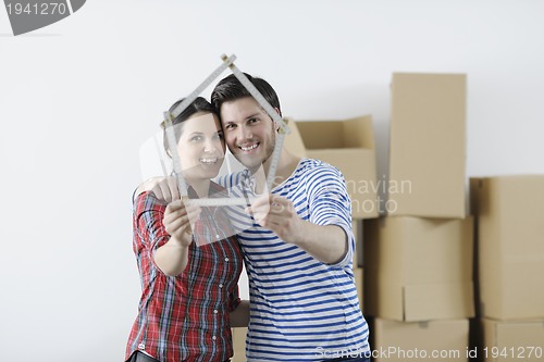 Image of Young couple moving in new home