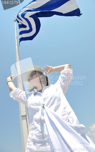 Image of Greek woman on the streets of Oia, Santorini, Greece