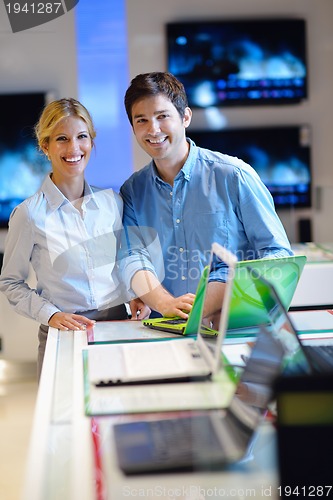 Image of people buy  in consumer electronics store