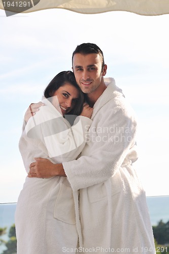 Image of couple relaxing on balcony