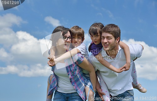 Image of happy young family have fun outdoors