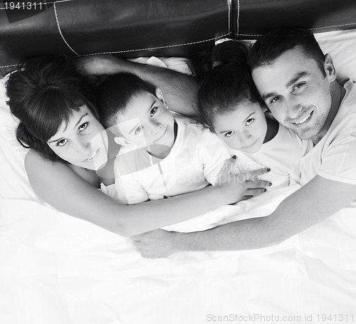 Image of happy young Family in their bedroom