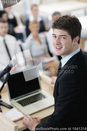 Image of Young  business man giving a presentation on conference