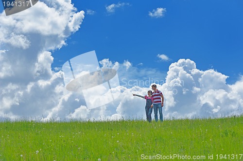 Image of Portrait of romantic young couple smiling together outdoor