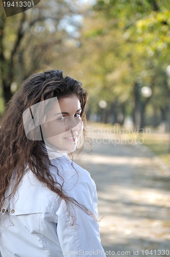 Image of brunette Cute young woman  posing outdoors