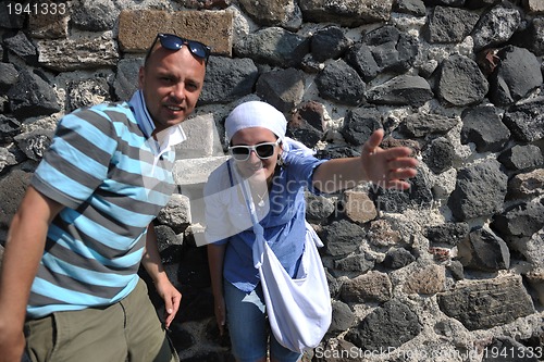 Image of happy young couple tourists in greece