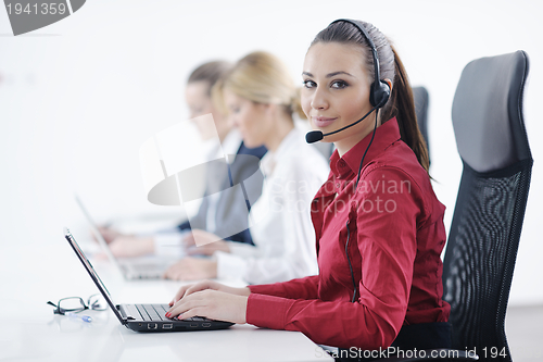 Image of business woman group with headphones