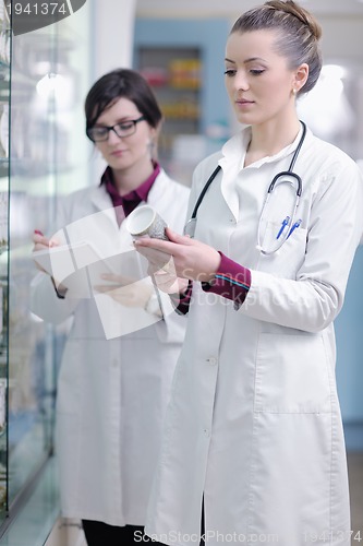 Image of team of pharmacist chemist woman  in pharmacy drugstore