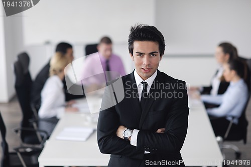 Image of young business man at meeting