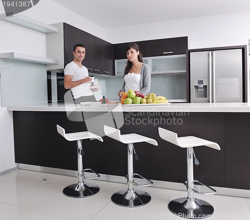 Image of young couple have fun in modern kitchen