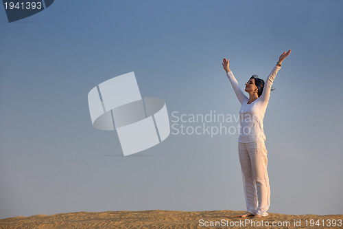 Image of woman relax in desert