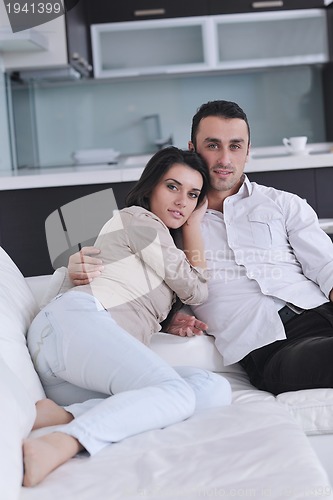 Image of happy young couple relax at home