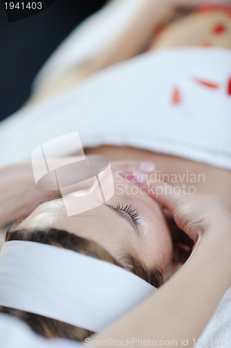 Image of Beautiful young woman in spa