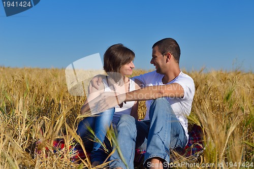 Image of happy couple in wheat field