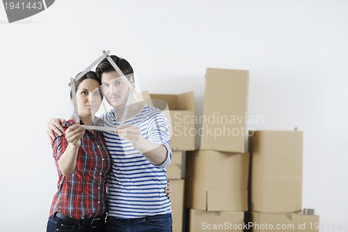 Image of Young couple moving in new home
