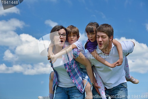 Image of happy young family have fun outdoors