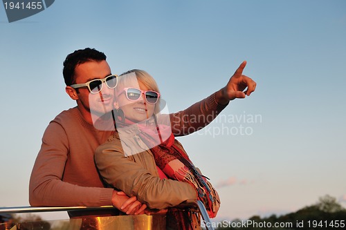 Image of couple in love  have romantic time on boat