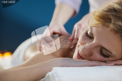 Image of Beautiful young woman in spa